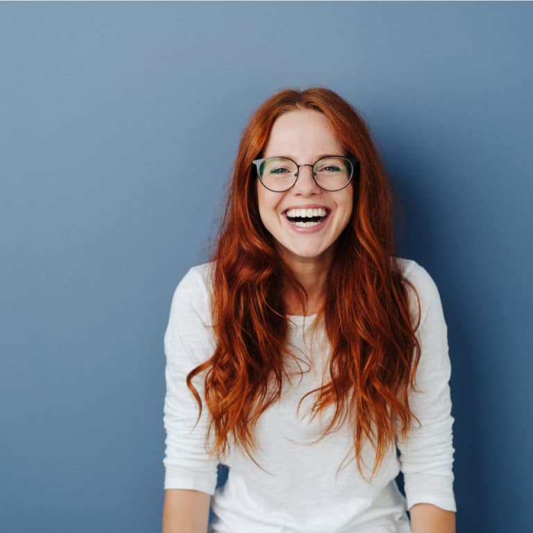 a smiling girl views virtual results before starting Invisalign treatment in Calgary