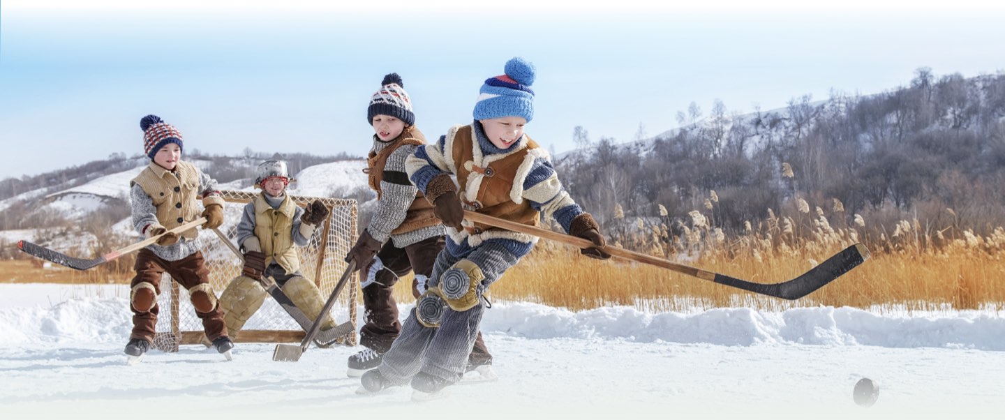 boys-playing-ice-hockey Children of the local community playing Hockey with healthy teeth